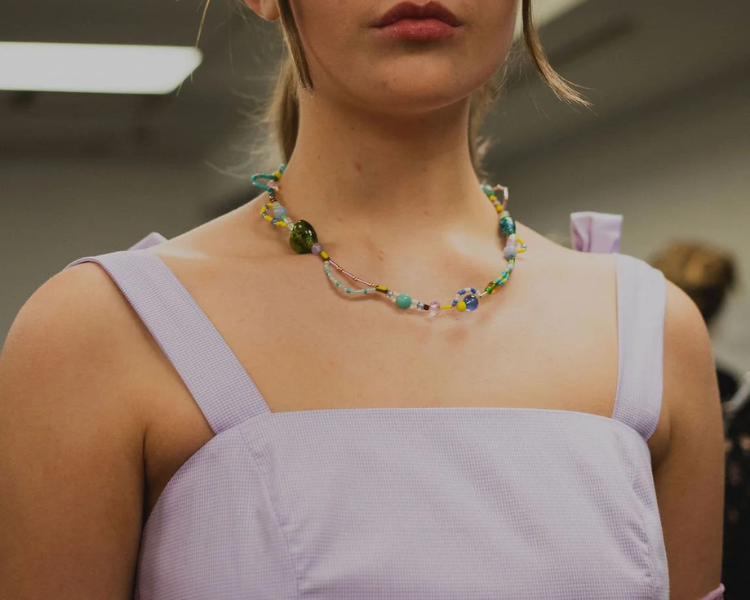 Model wearing a mixed bead necklace